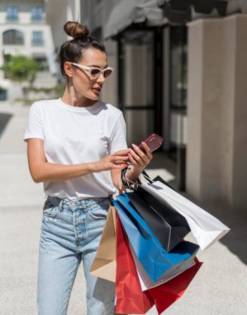 adult-woman-posing-with-shopping-bags