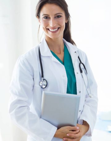 beautiful-young-female-doctor-looking-camera-office