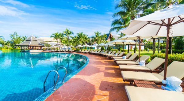 hammocks-umbrella-placed-near-large-pool