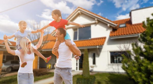happy-family-near-new-house-real-estate-concept