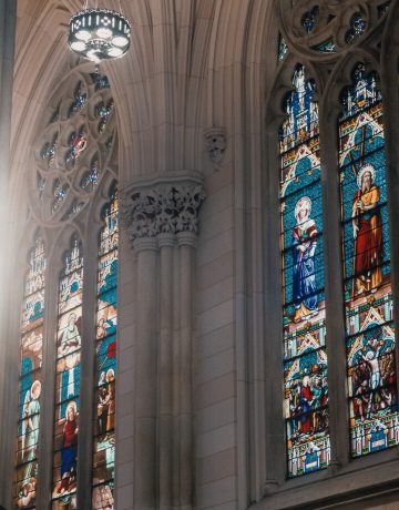 interior-church-with-gray-walls-mosaic-paintings-religious-saints-windows